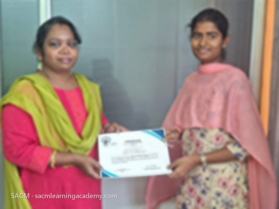 SACM student receiving a certificate of completion from her trainer
