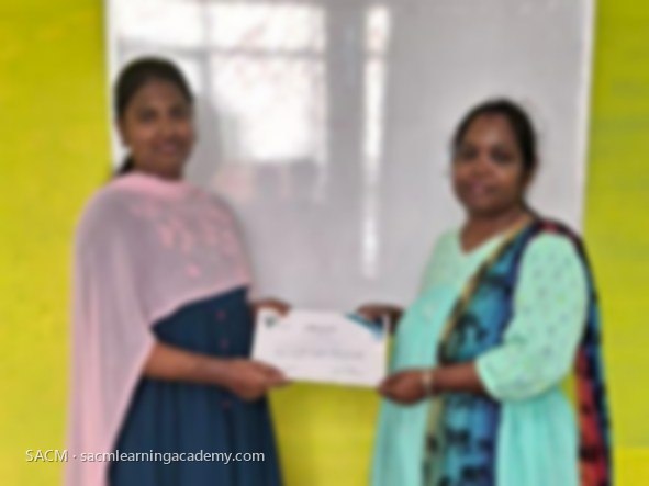SACM student receiving a certificate of completion from her trainer
