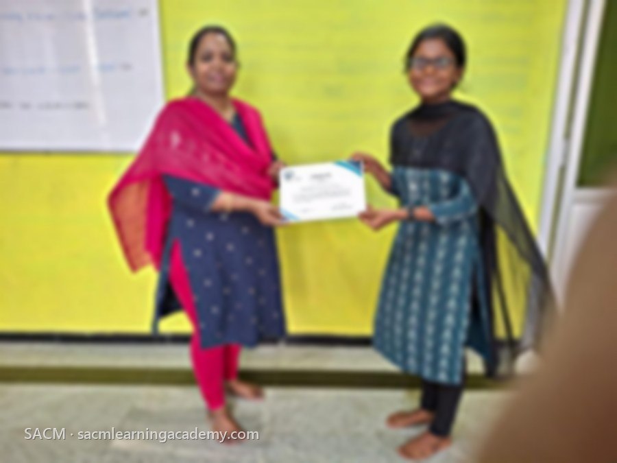 SACM student receiving a certificate of completion from her trainer