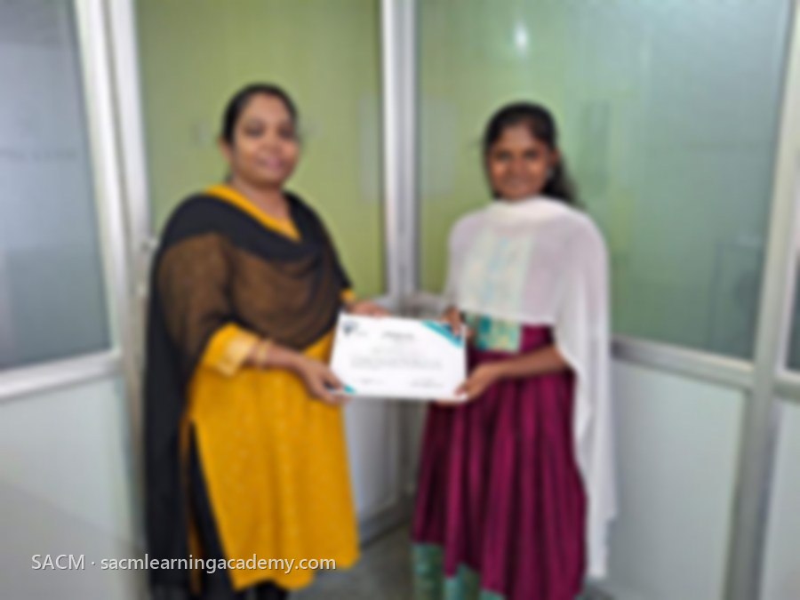 SACM student receiving a certificate of completion from her trainer