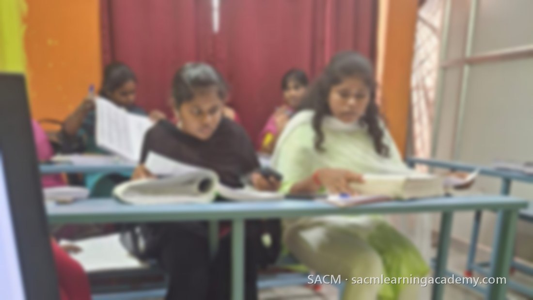 Students working through coding manuals